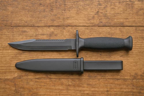 Glock Feldmesser military knife on a wooden surface